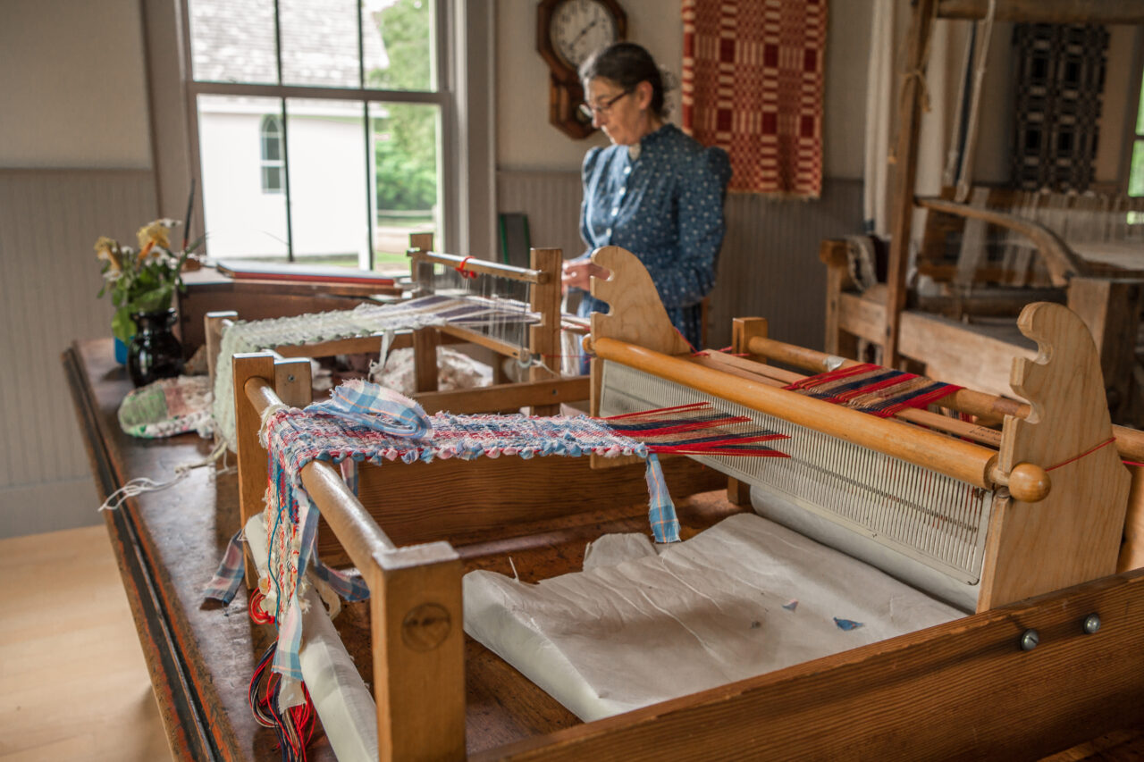 woman using a jacquard loom