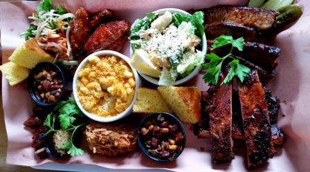 a tray with ribs and bread