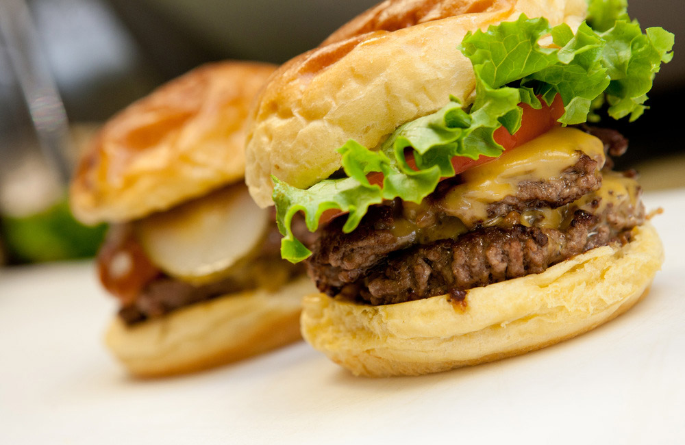 A close up of two hamburgers
