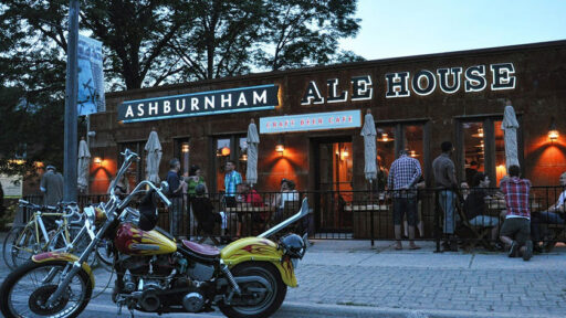 Outside of the Ashburnham Ale House with motorcycles parked in front of the building