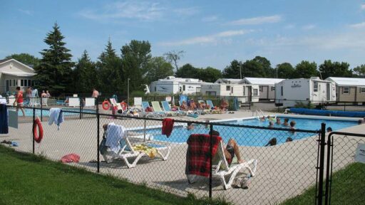 People relaxing and swimming in an outdoor pool
