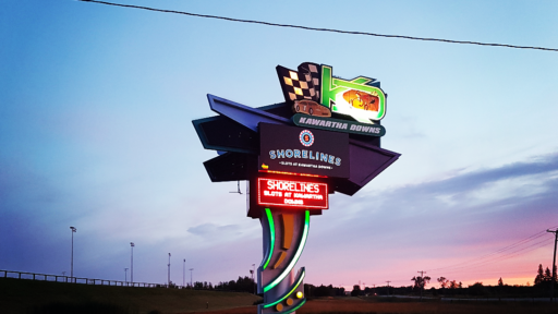 a image of stores light up sign at sunset