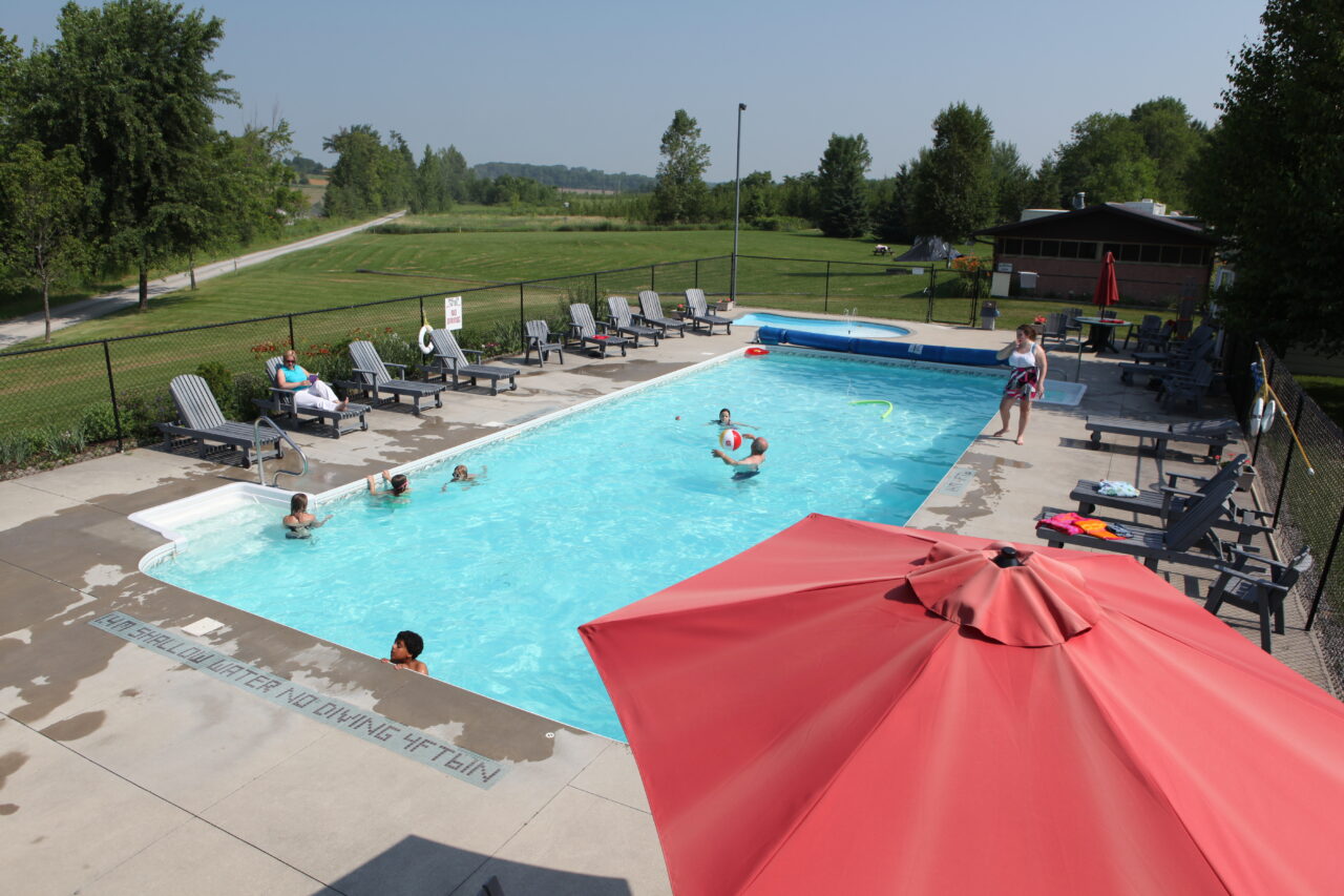 wide view of pool and surrounding property