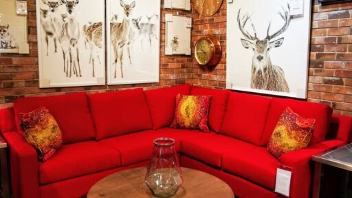 a red couch with a wood table