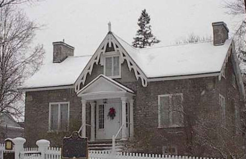 a brick house covered in snow during winter in Peterborough & the Kawarthas