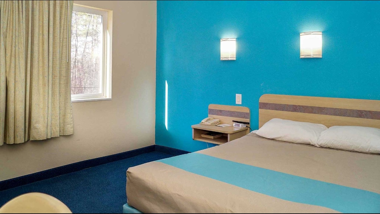 interior of single bed motel room