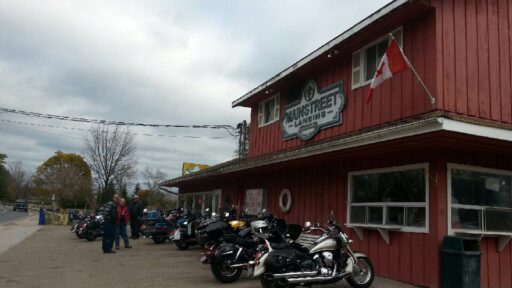 outside store, red building with motor cycles in front
