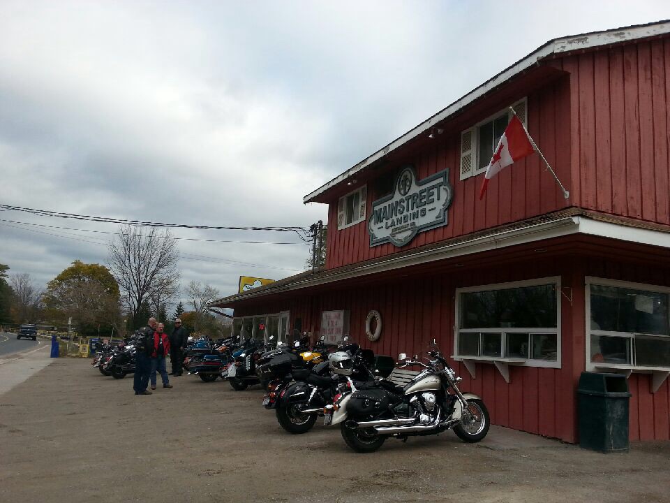 outside store, red building with motor cycles in front