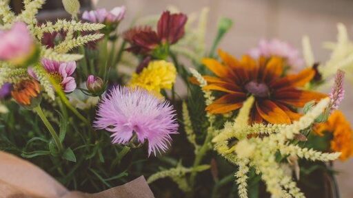 a jar of a variety of flowers