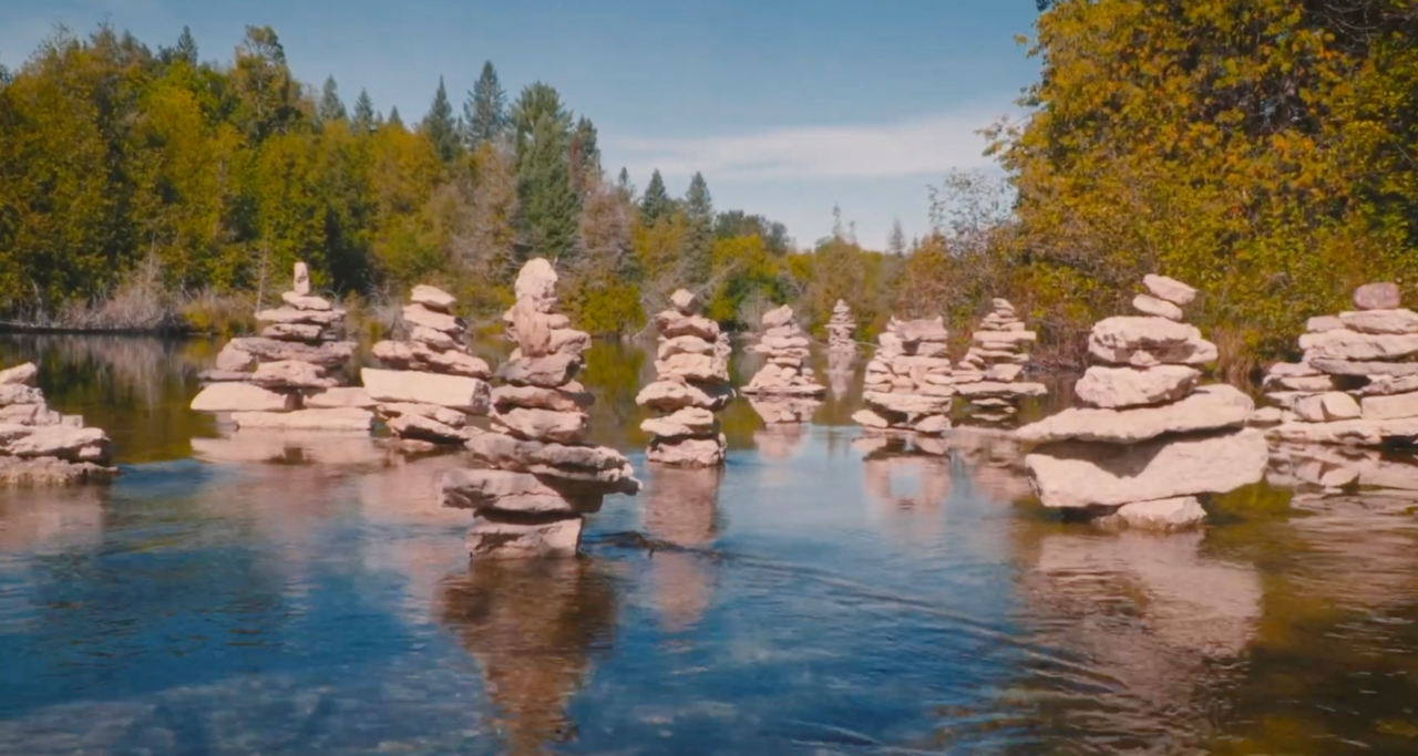 stacks of rocks in a river