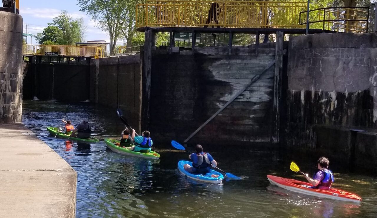 people kayaking into the locks