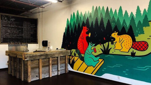 inside store painting of lake and forest on wall