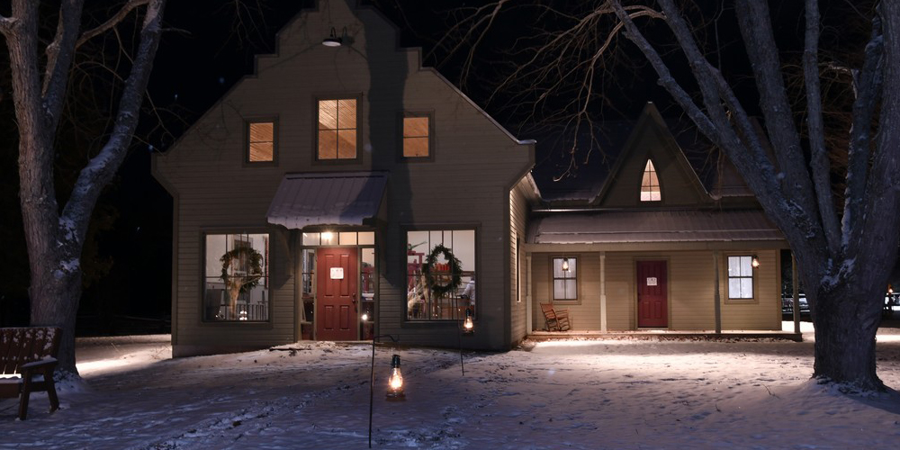 historic house decorated for Christmas at night