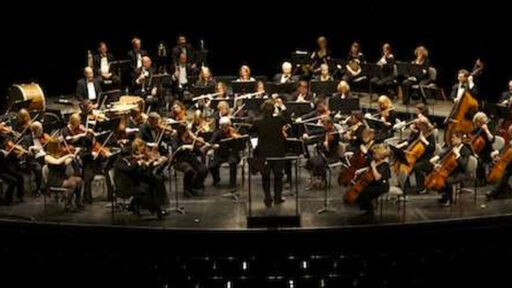 an orchestra playing on a stage