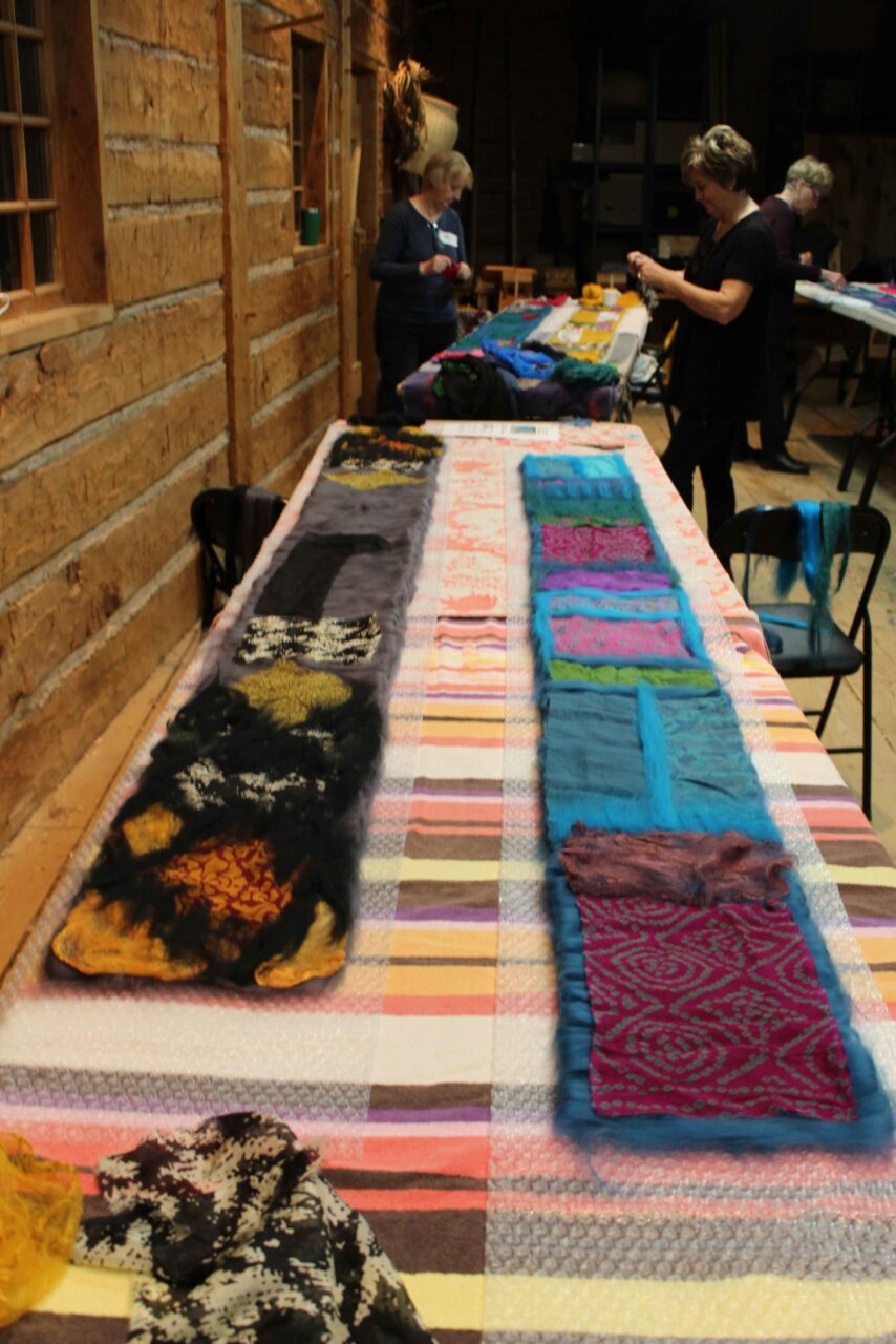 Wet felted scarves on a table