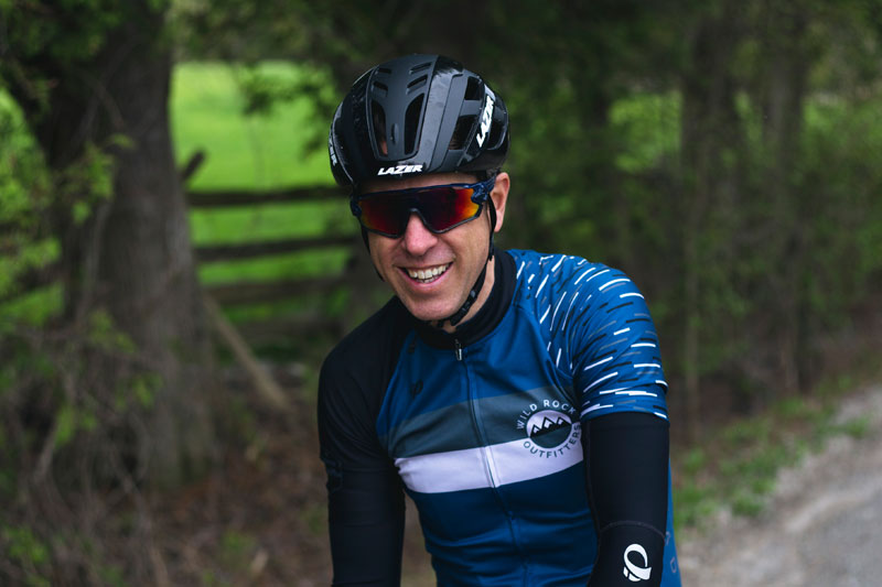 Smiling person wearing cycling gear