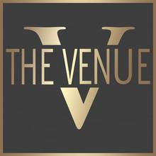 the venue logo with a giant letter v in the background.