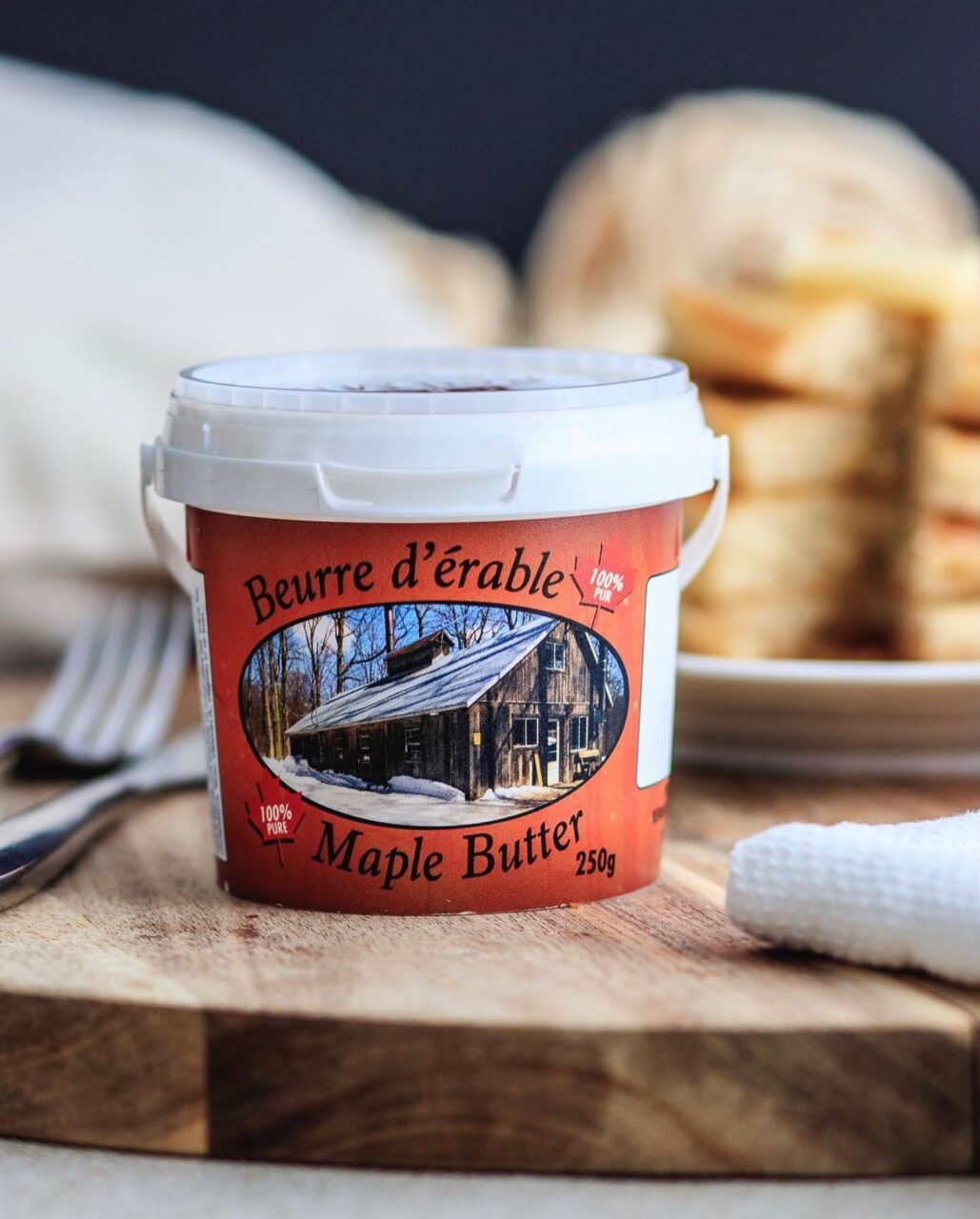 a container of maple butter on a table