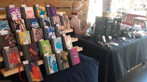 a table with journals for sale at a craft sale