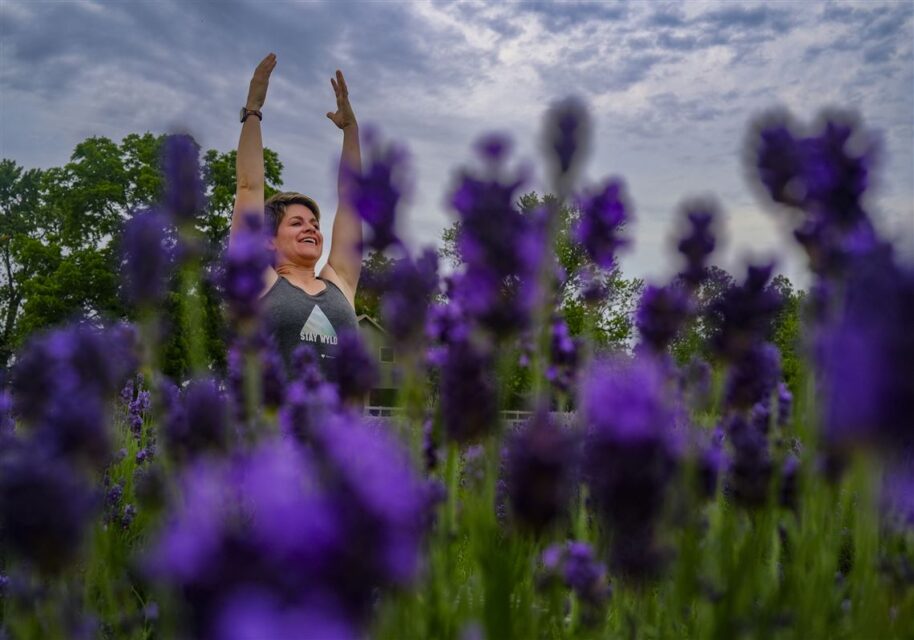 woman doing yoga in a lavender field