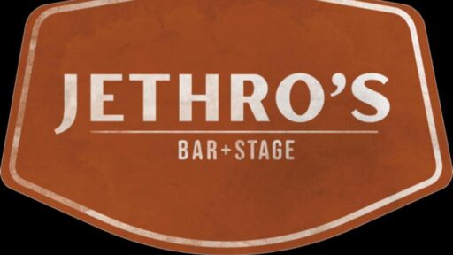 black background with brown rectangle with "jethros bar & stage" written in white in the middle