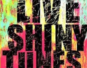 an image of splattered paint with the text that says live shiny tunes