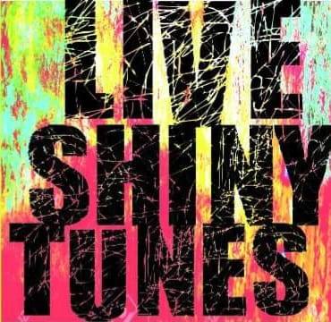 an image of splattered paint with the text that says live shiny tunes