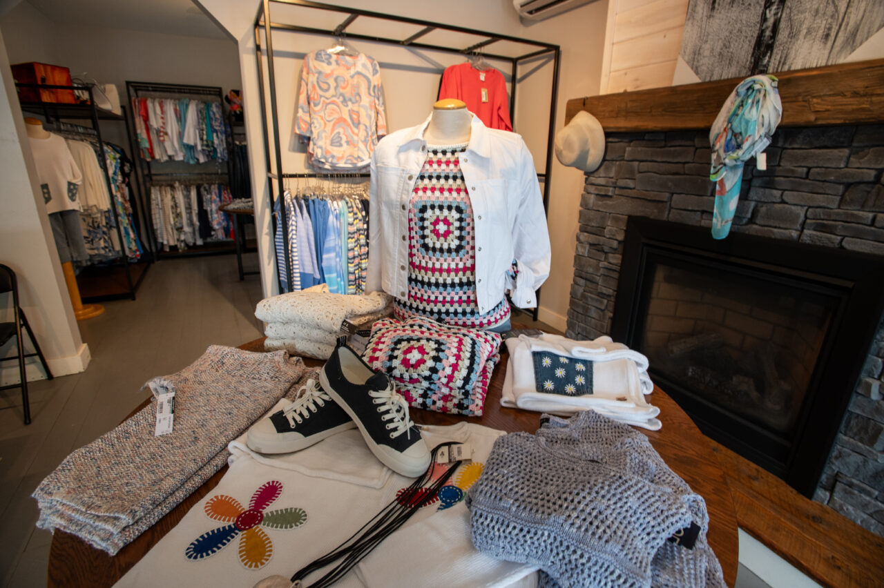 Clothing display with shoes and accessories inside Dan Joyce Clothing store in Apsley