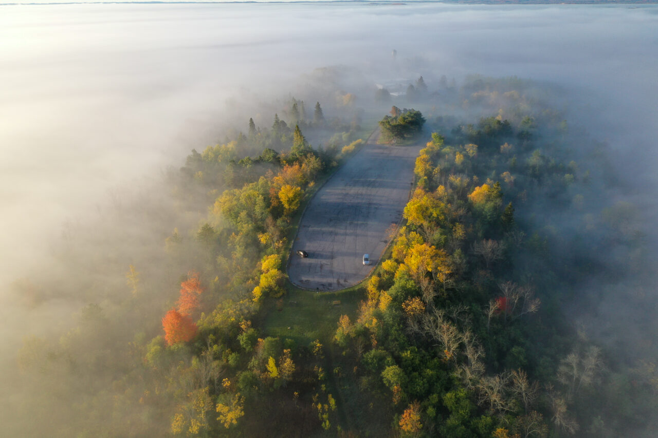 an aerial image of Ashburnham Memorial Park with fog in the trees