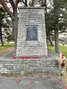a memorial cairn and plaque dedication for WW1 veterans