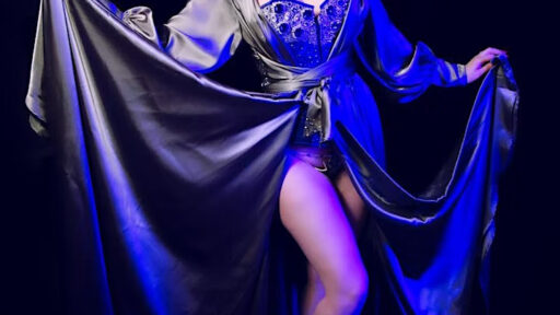 a woman dressed in a burlesque outfit