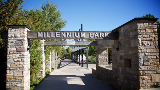 an image of a park sign on rock pillars, that says Millennium Park