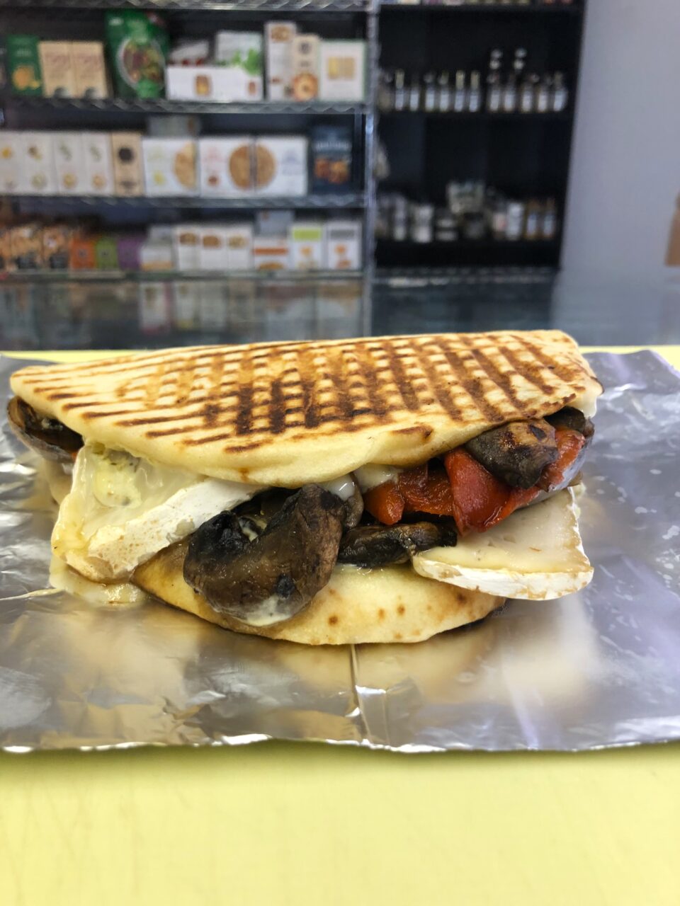 Flat bread sandwich with grilled veggies and brie