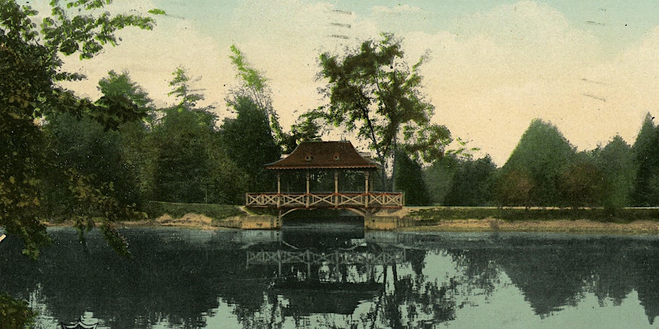a historical image of a bridge in a park surrounded by water