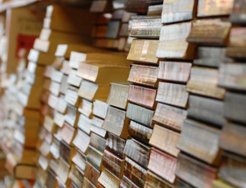 an image of books stacked on a shelf