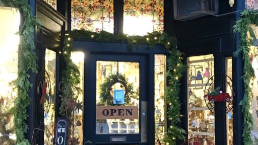 Looking at the Garden Style entrance with sign above the door, decorated for Christmas