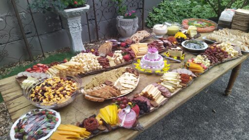 Table top covered in charcuterie items from Cheesy Fromage