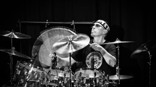 man playing a full drumset