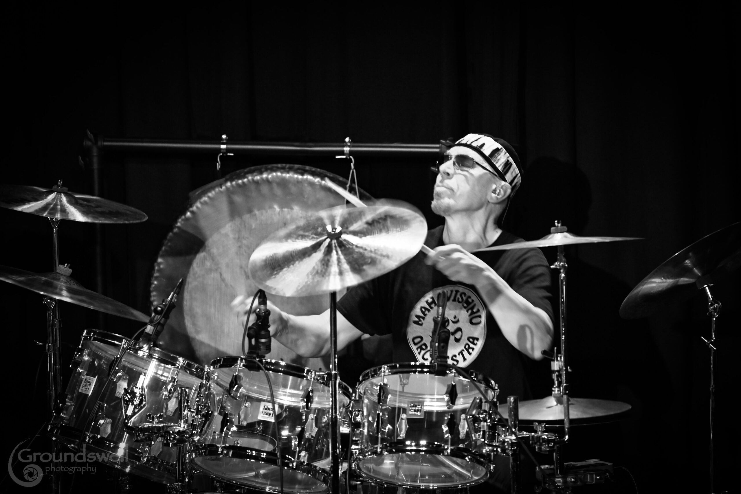 man playing a full drumset