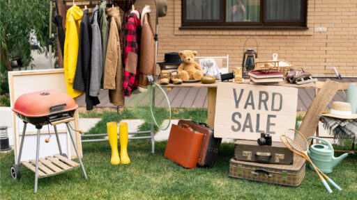 yard sale tables with various common yard sale items