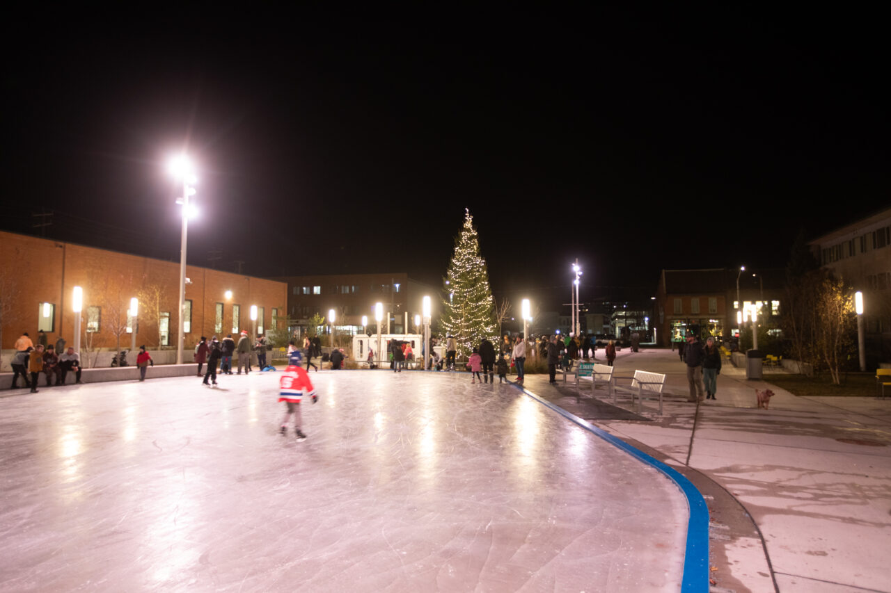 Skating at Night at Quaker City Square, Christmas Tree in the Background.