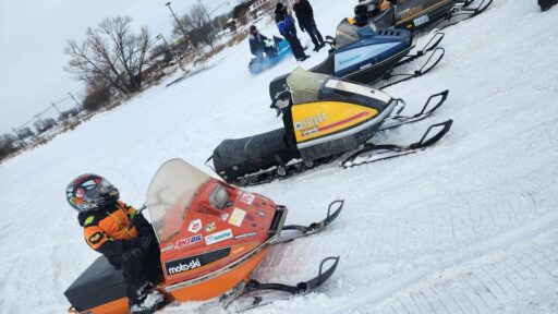 snowmobiles lined up