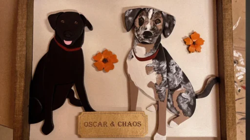 wood portrait of two dogs