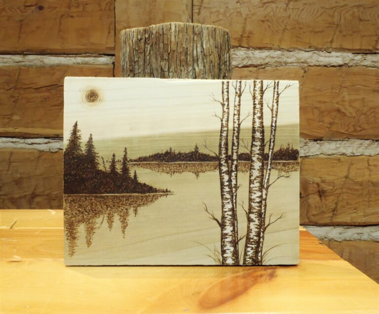 woodburning portrait of a lake landscape