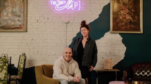 The El P owners Amanda and Greg Da Silva in the restaurant under a neon sign that says "The El [P]