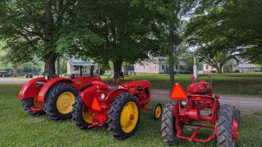 three red tractors