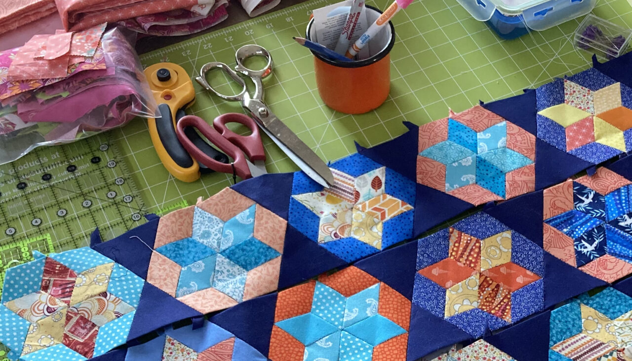 A variety of quilting materials on a table