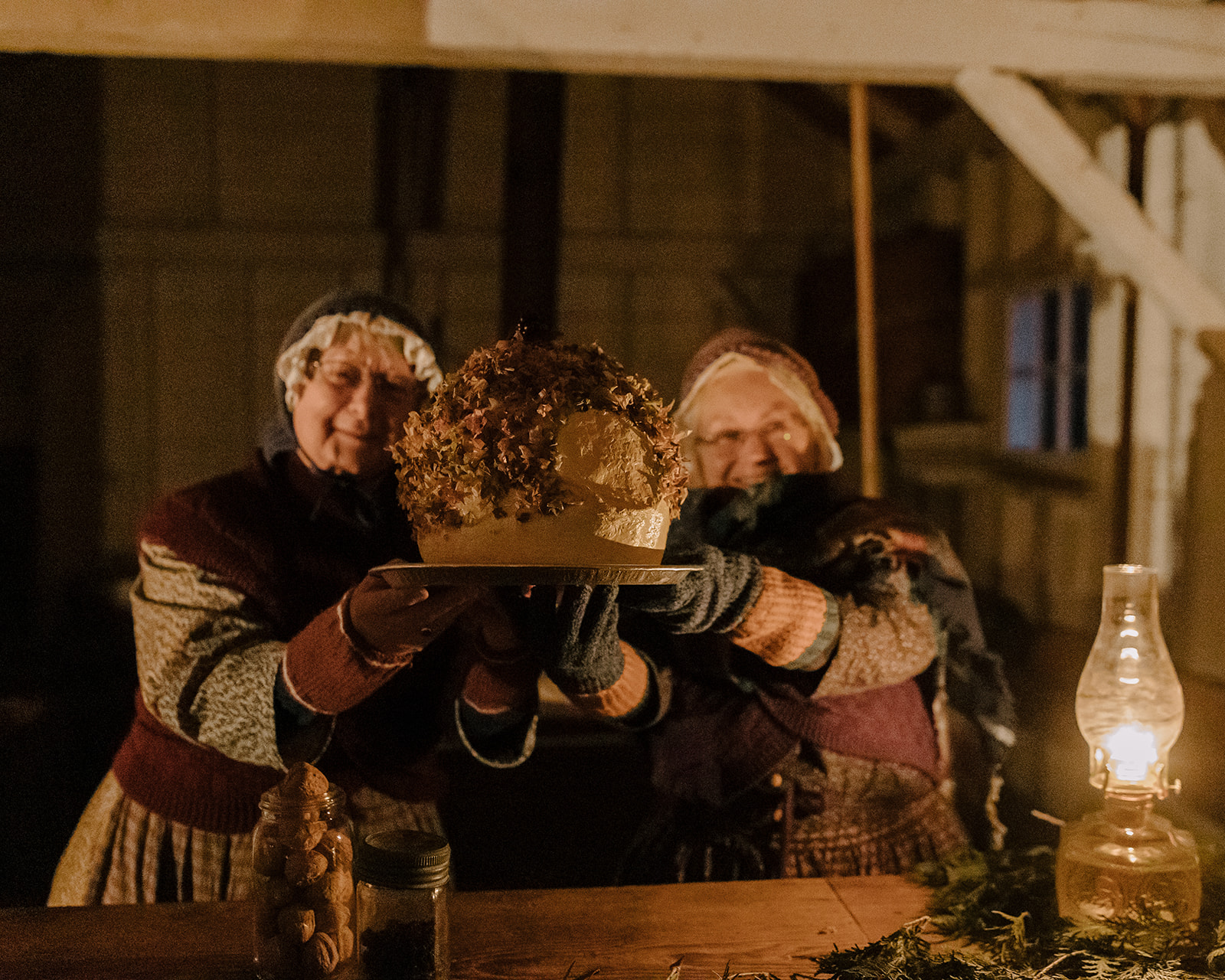 two woman holding a loaf