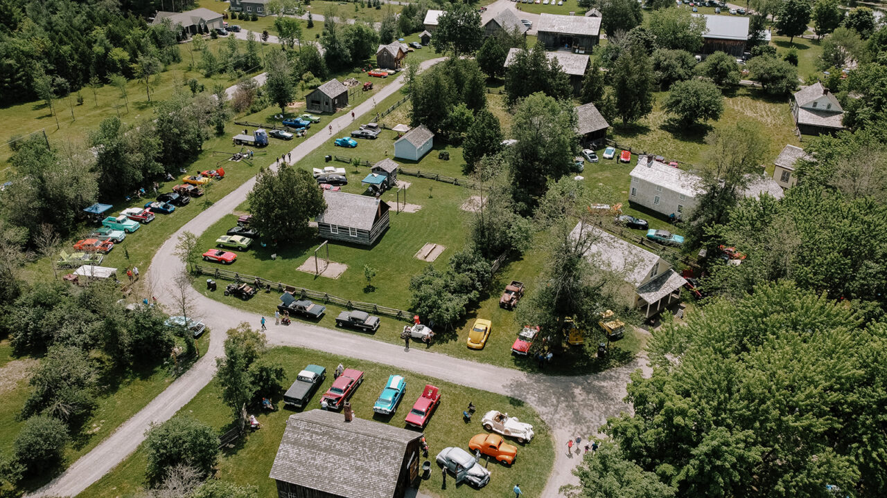 aerial photo of cars at lang pioneer village