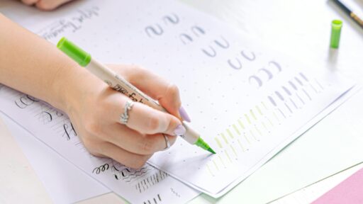 a person practicing doing letters